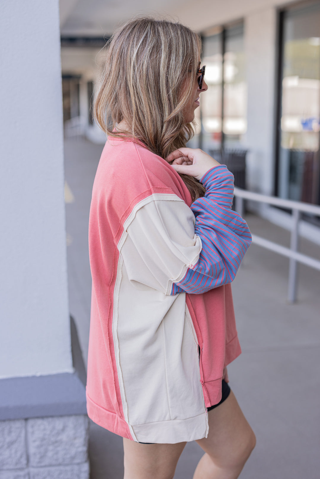 Women's dark coral and taupe terry knit pullover top with stripe details by Easel showing up close side view