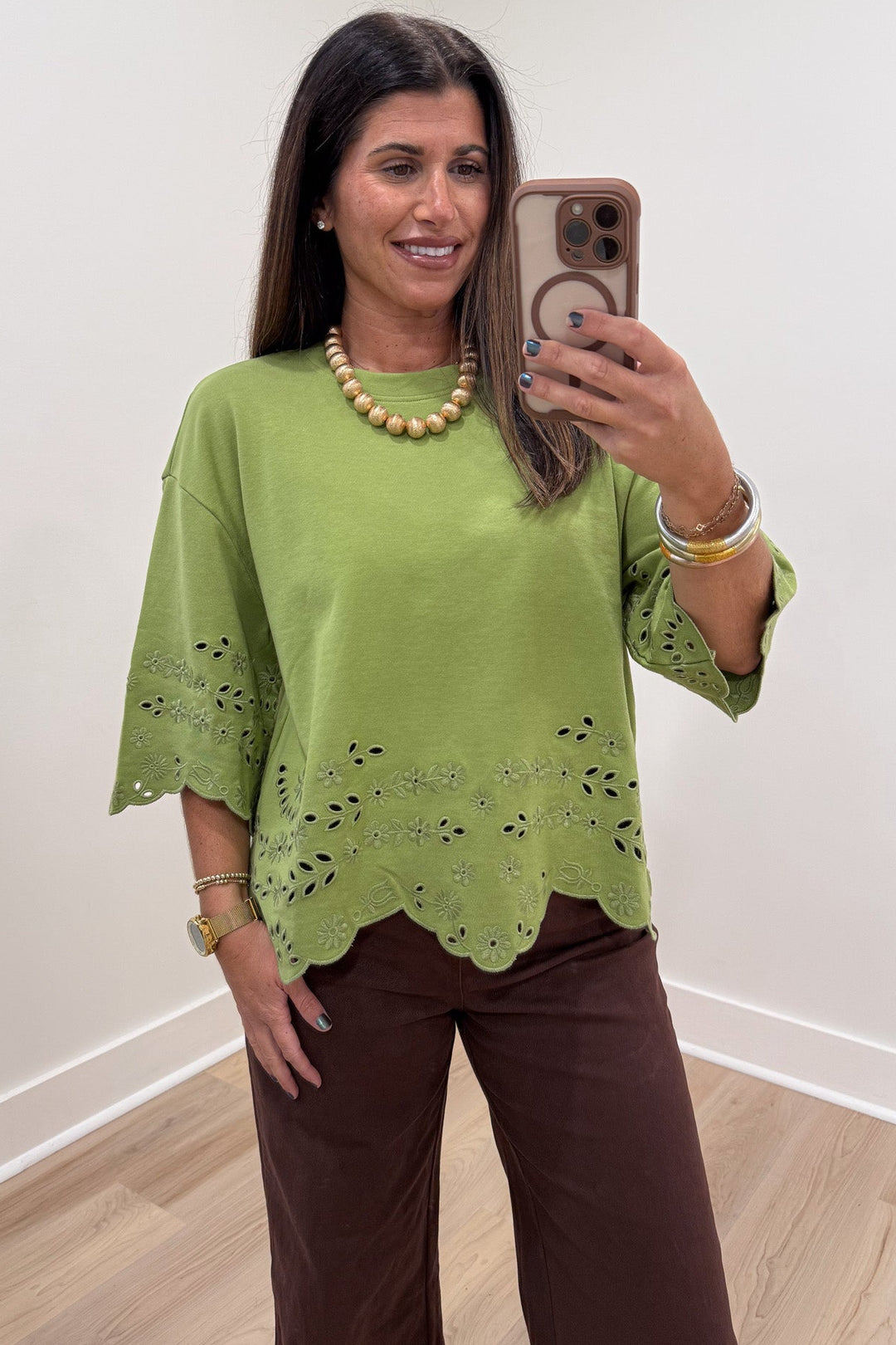 solid grass green floral eyelet accents scalloped hem half sleeve knit top