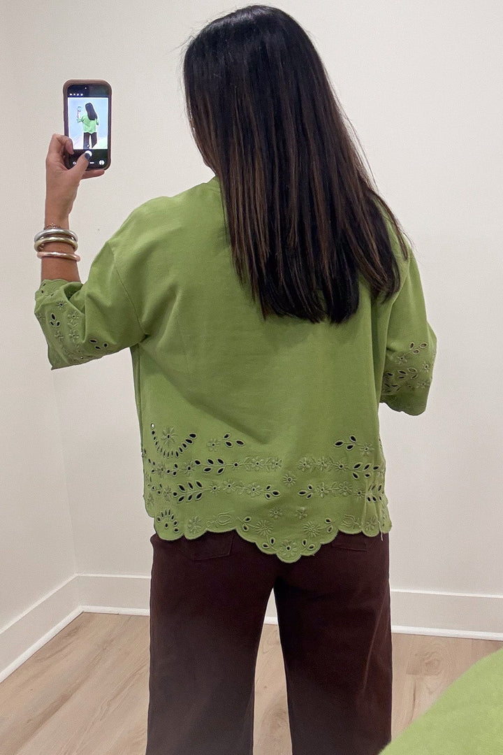 solid grass green floral eyelet accents scalloped hem half sleeve french terry knit top