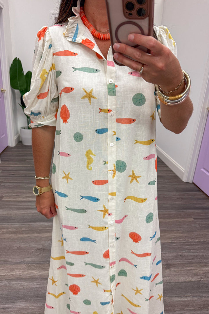 ivory with multicolored fish and seashell print ruffle trimmed mock neck button front maxi dress