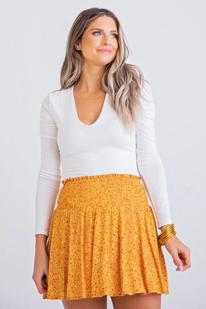 Women's marigold ditzy floral print smocked skirt lined with shorts by Karlie
