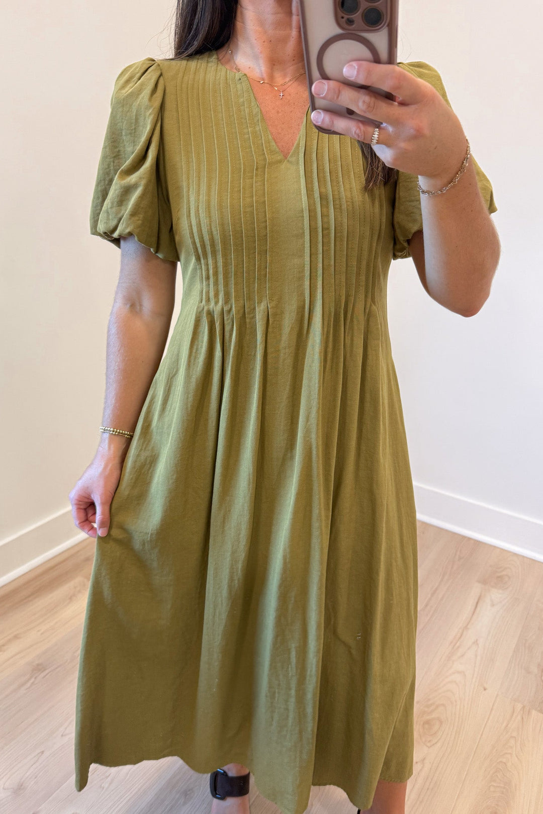 solid light olive green cuffed short puff sleeve v neckline pleated bodice midi dress