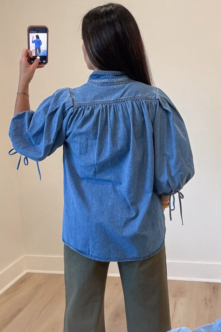 solid medium blue denim button front bodice 3/4 length puff sleeve top with back gathered detail