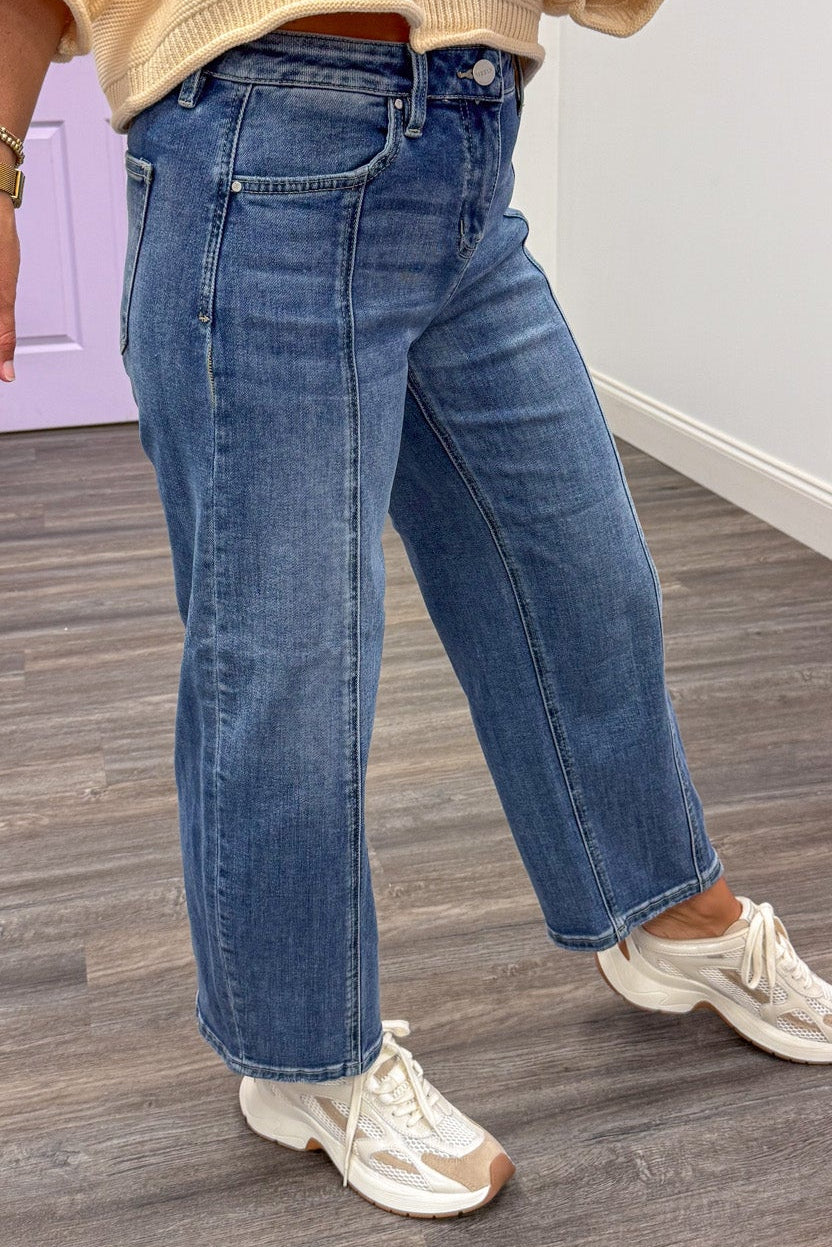 medium washed slouchy cropped length barrel leg high rise jeans with seam details