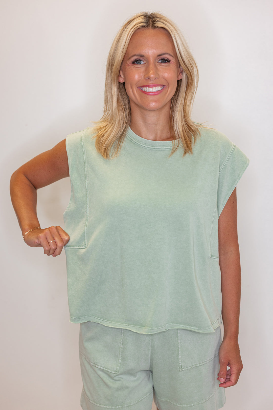 Women's mineral washed mint latte green knit sleeveless top by Rae Mode showing the relaxed fit