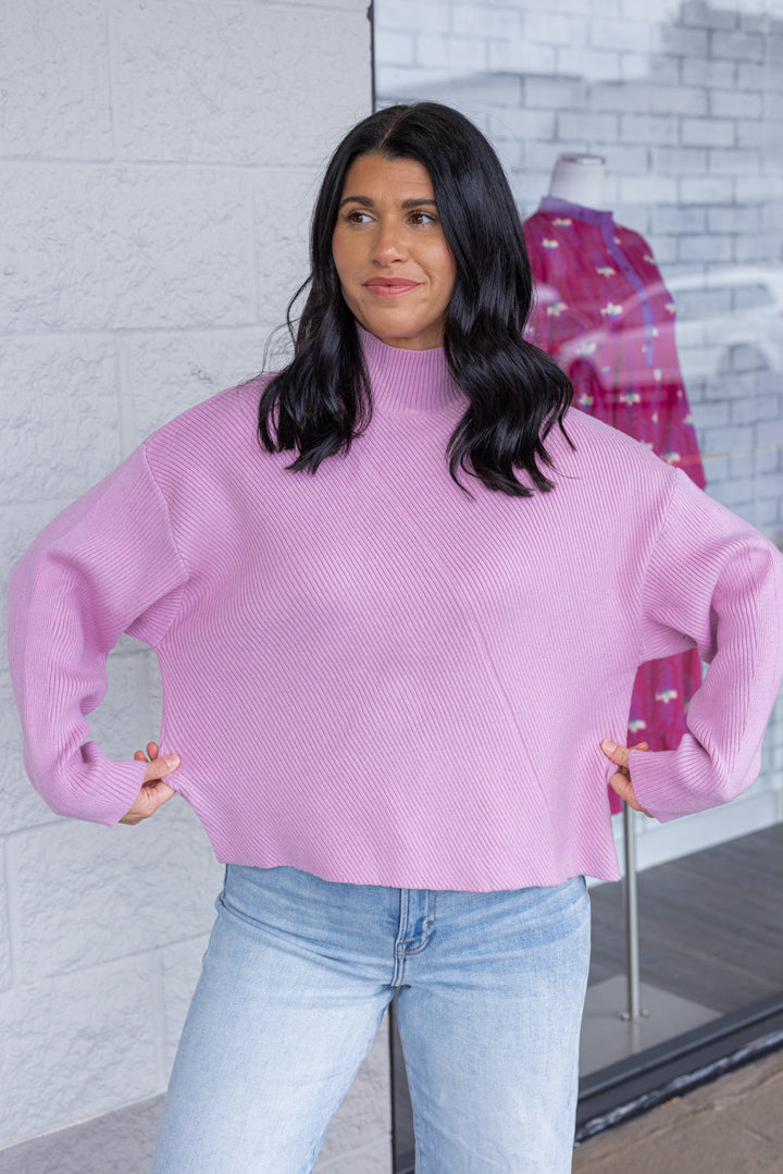 Women's frost pink diagonal ribbed knit sweater top by Hyfve showing true to size fit