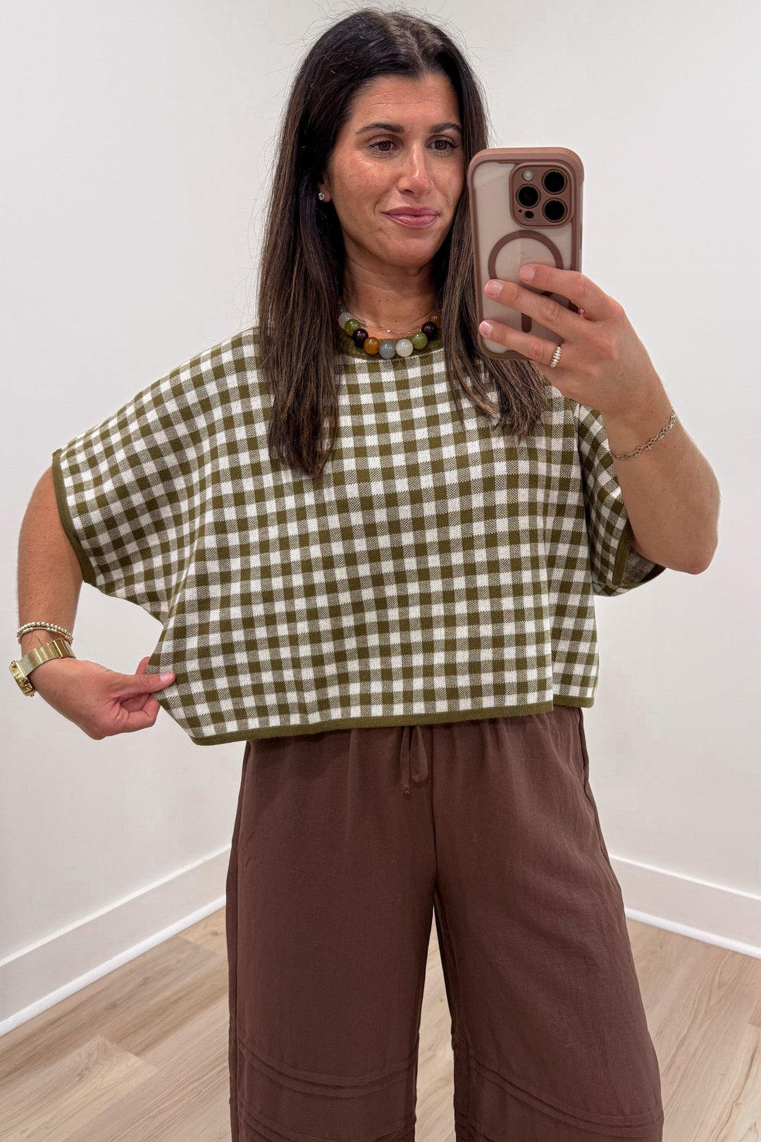 olive green and ivory gingham checkered print short sleeve relaxed silhouette semi-cropped knit top