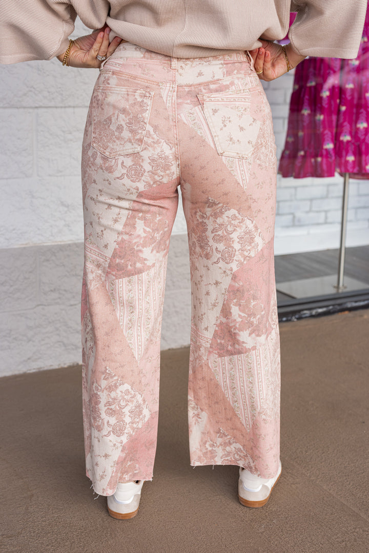 Women's vintage rose pink twill denim pants with floral patchwork print by Easel showing up close back view