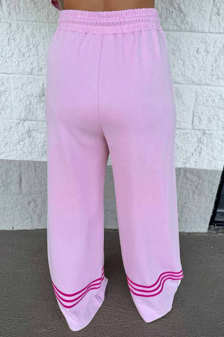light pink with hot pink stripes at hem elastic waist relaxed silhouette wide leg knit pants
