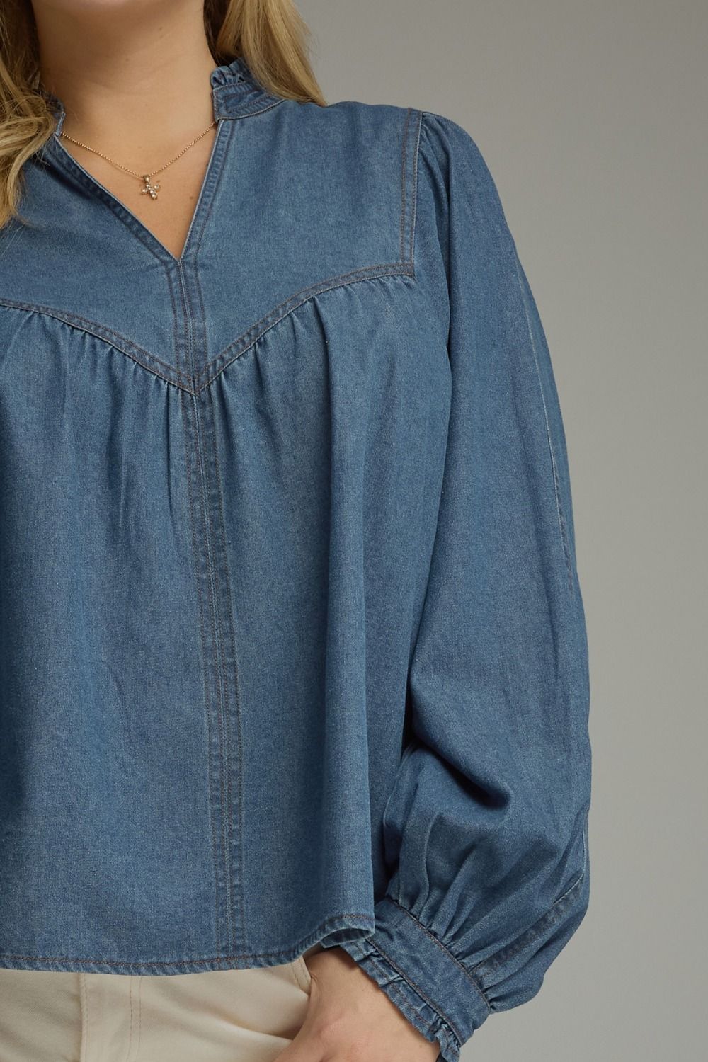 Entro plus size washed denim babydoll top with ruffle trim around the neck