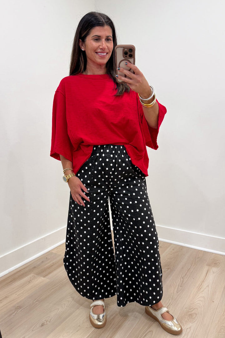 polka dot black and white pants with red tee