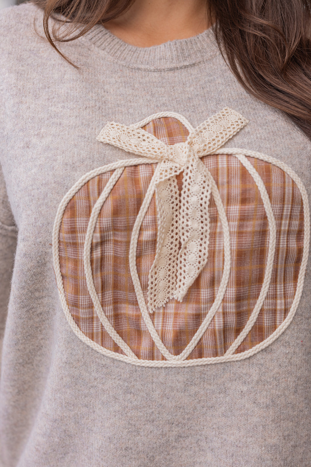 Women's grey knit sweater by Fantastic Fawn showing brown plaid pumpkin and cream lace detail on front
