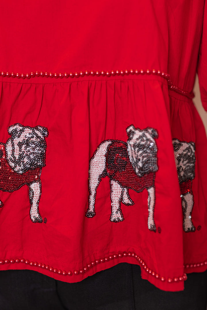 Women's red peplum top with sequin UGA Bulldogs and red pearl trim by Stewart Simmons showing pearl trim details