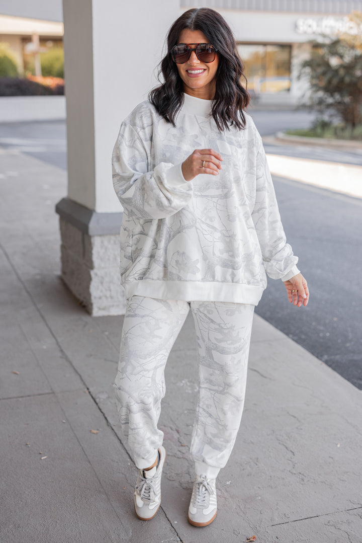Women's grey snow camo oversized sweatshirt by BucketList, perfect for cooler weather