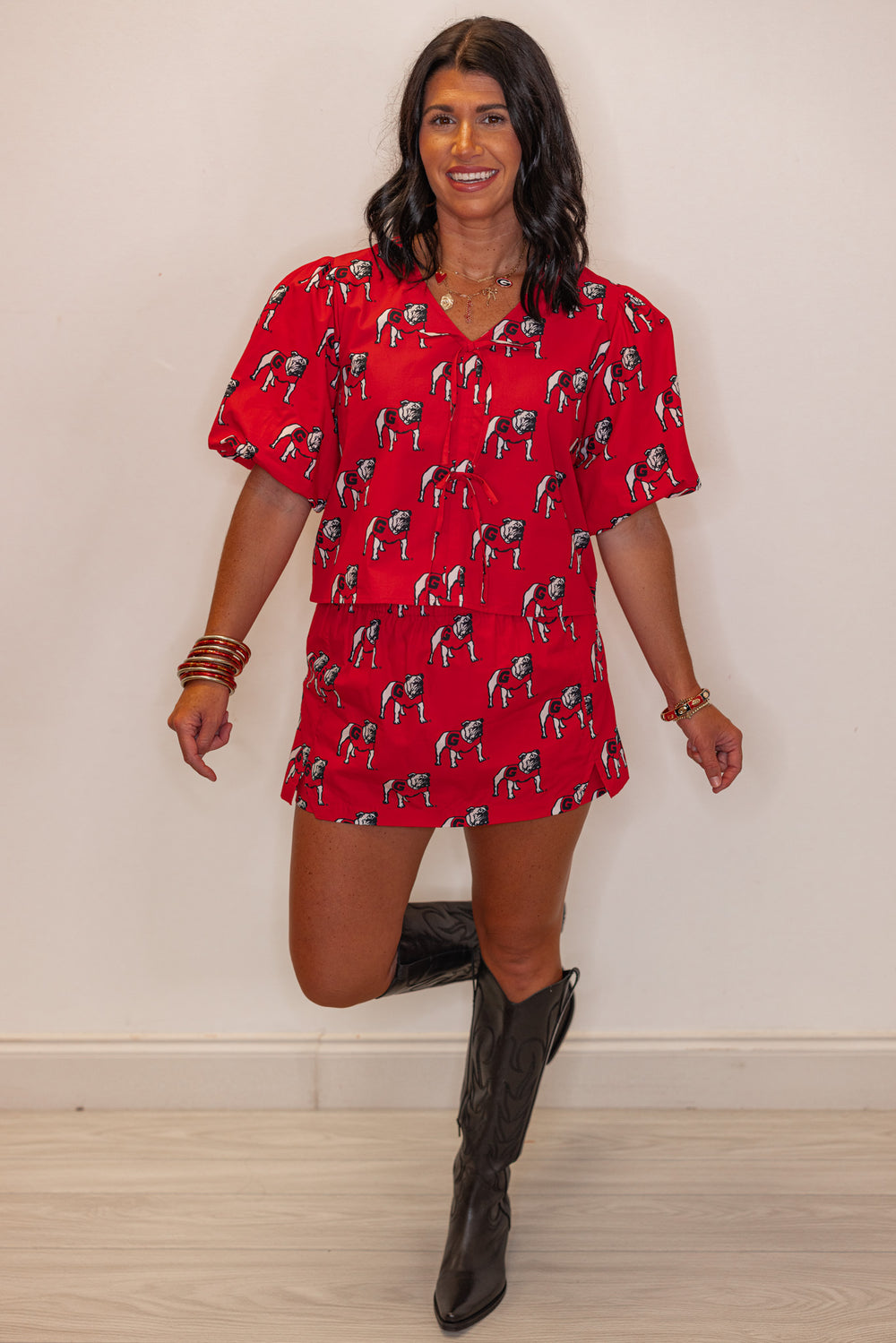 Women's red Bulldogs poplin top by Stewart Simmons shown with matching skort