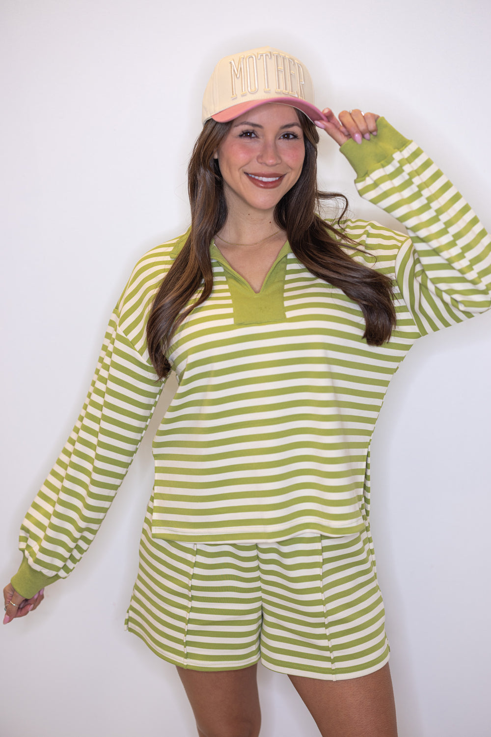 Women's ribbed knit shorts in matcha green and cream stripes by Entro shown up close with matching top