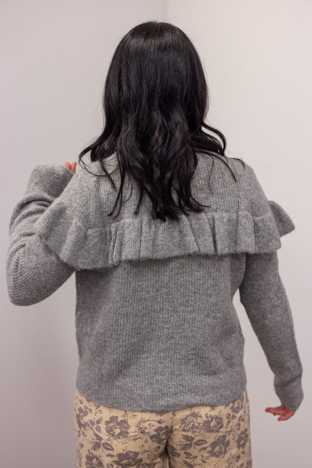 Women's grey knit sweater with a ruffle across the front chest and back shoulders by Wishlist showing up close back view