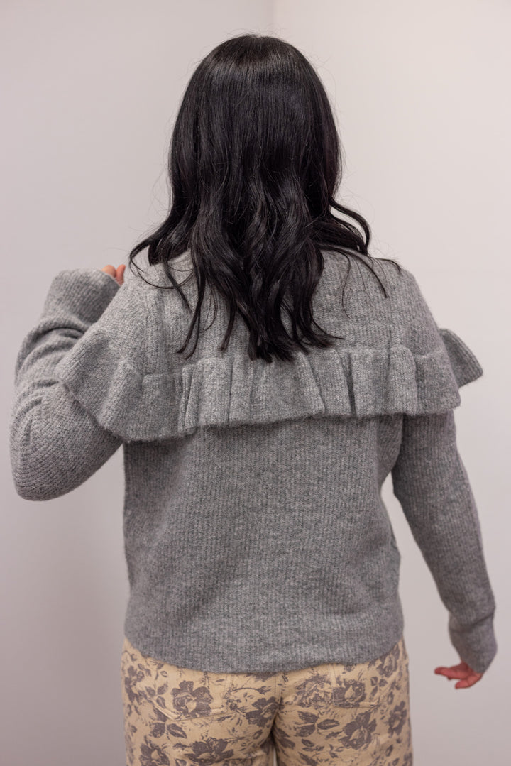 Women's grey knit sweater with a ruffle across the front chest and back shoulders by Wishlist showing up close back view