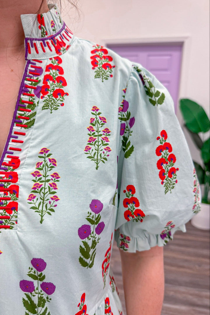 Women's light mint poplin dress showing trendy purple and red florals pattern