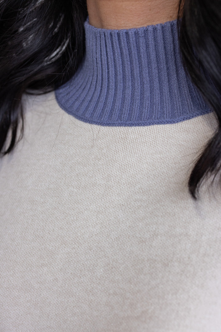 Women's ecru sweater knit pullover top with cornflower blue ribbed trim by Entro showing mock neckline