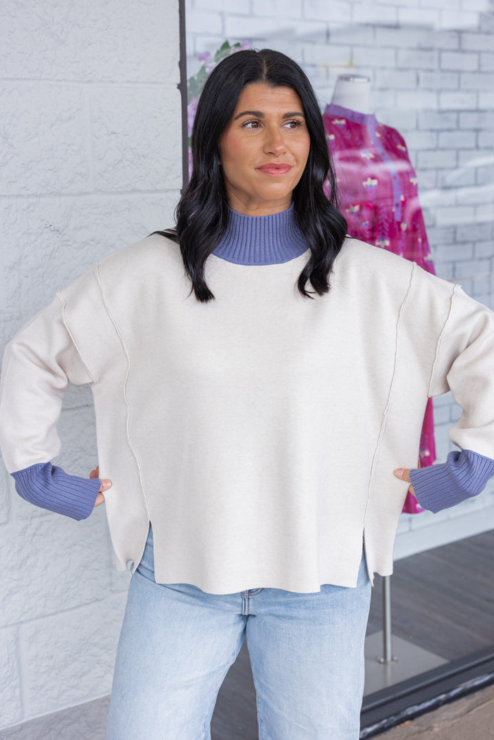 Women's ecru sweater knit pullover top with cornflower blue ribbed trim by Entro showing true to size fit