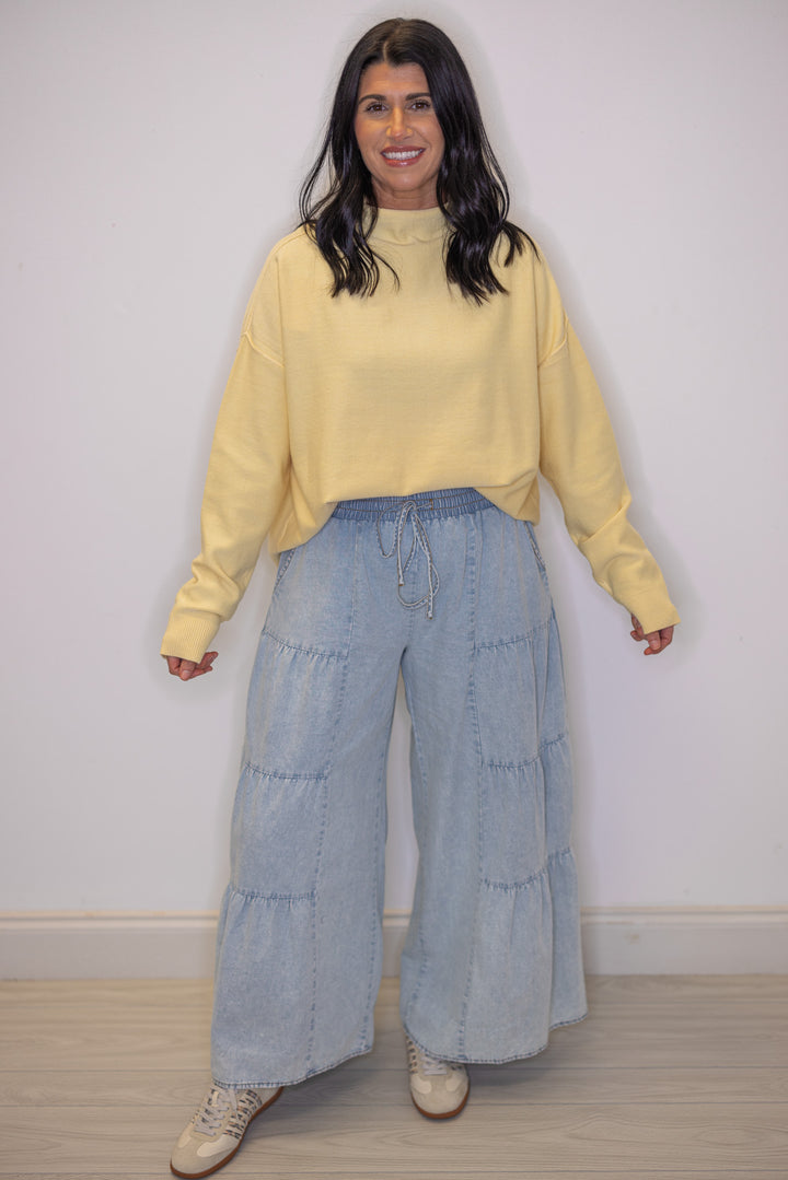 Women's light blue washed chambray denim wide leg pants with tiered detail, perfect for teachers