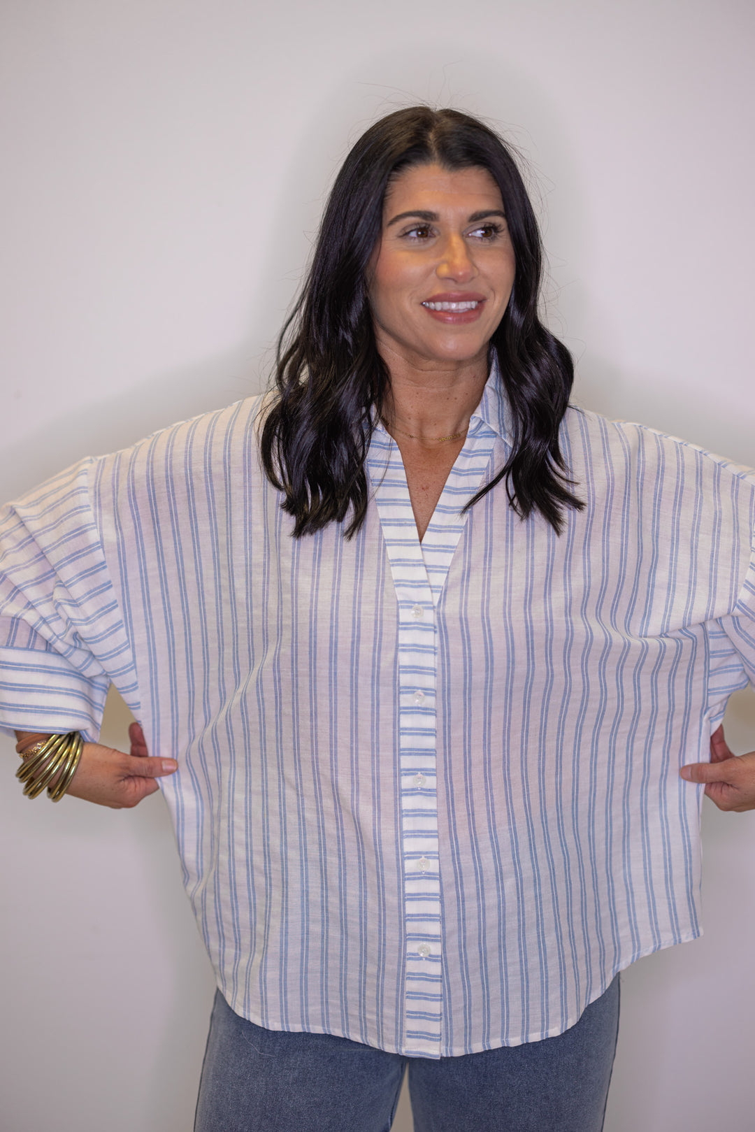 Women's relaxed light blue and cream striped button down top