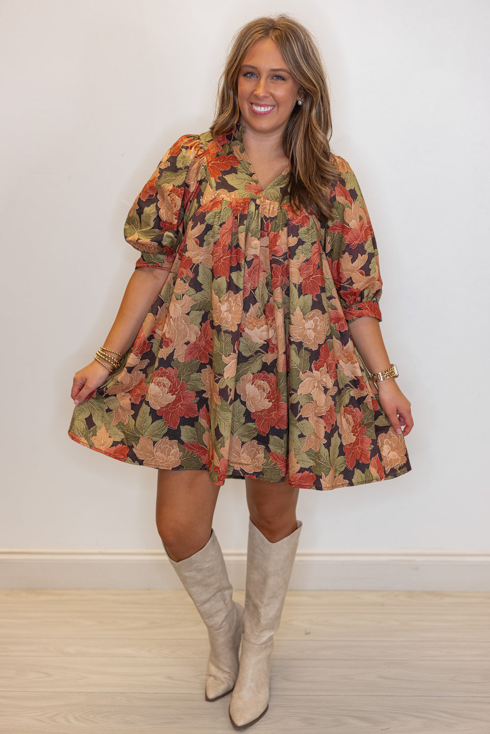 Women's brown babydoll dress with rusted burgundy, dusty peach and olive floral print by Entro showing full front view