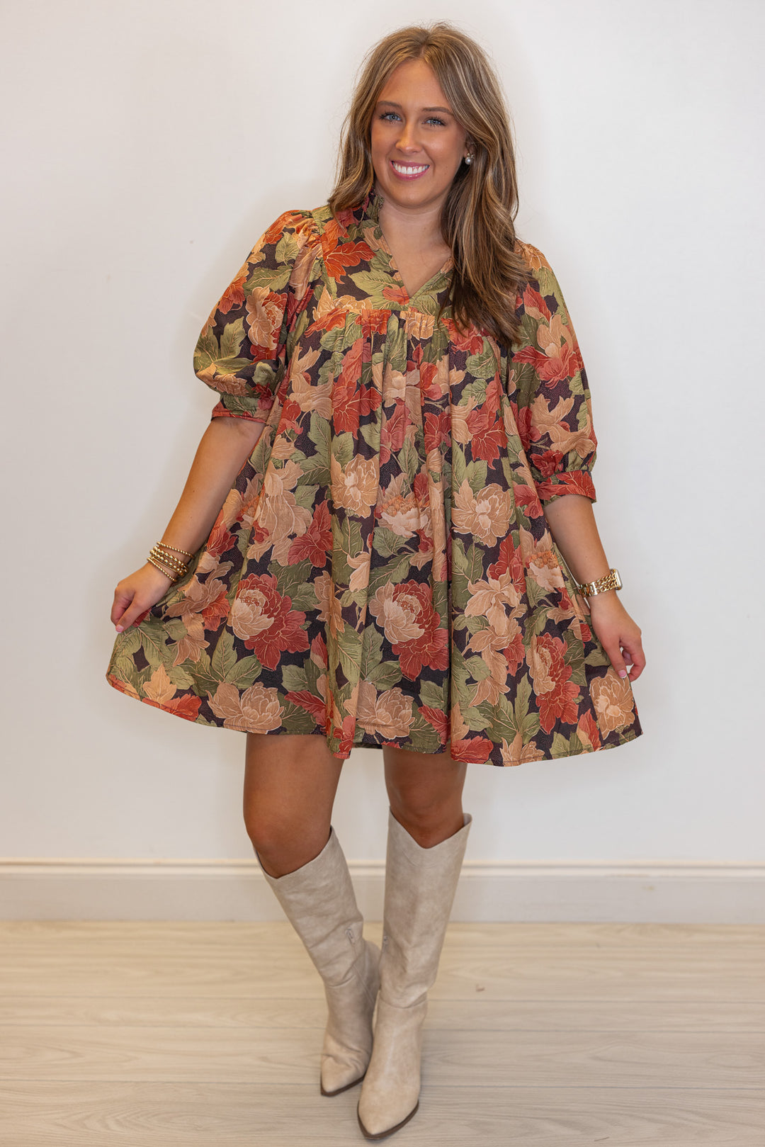 Women's brown babydoll dress with rusted burgundy, dusty peach and olive floral print by Entro showing full front view