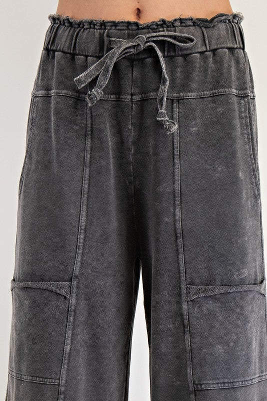 Women's terry knit wide leg pants in mineral washed black by Easel showing up close front view