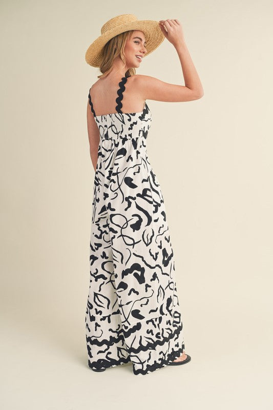 &merci White and black abstract print wide leg jumpsuit with scalloped ric rac trim