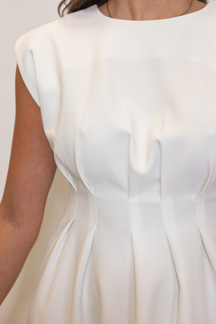 white pleated waist mini dress