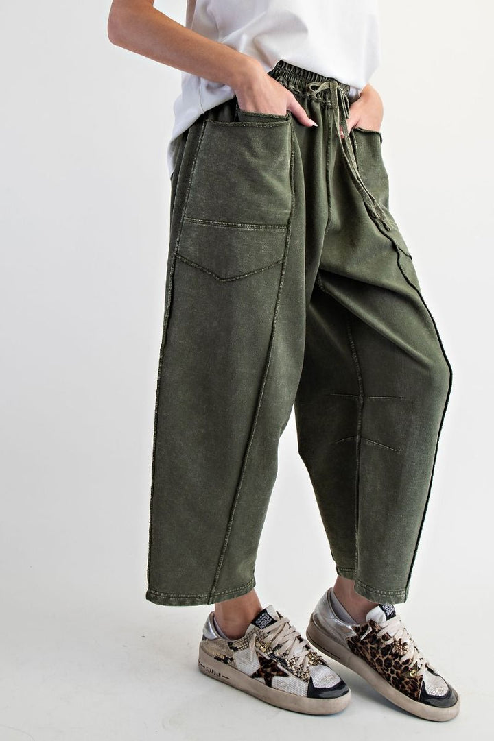 Person wearing green cargo pants and sneakers 