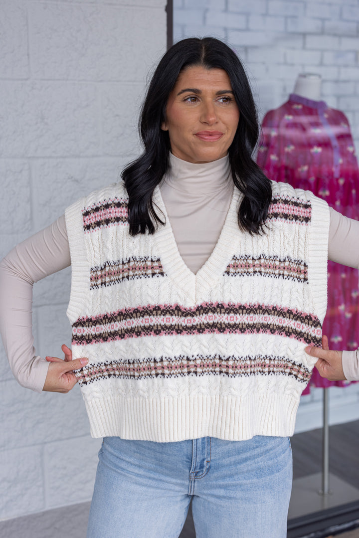 Women's ivory cable knit sweater vest style top with brown and pink stripes by idem ditto showing true to size fit
