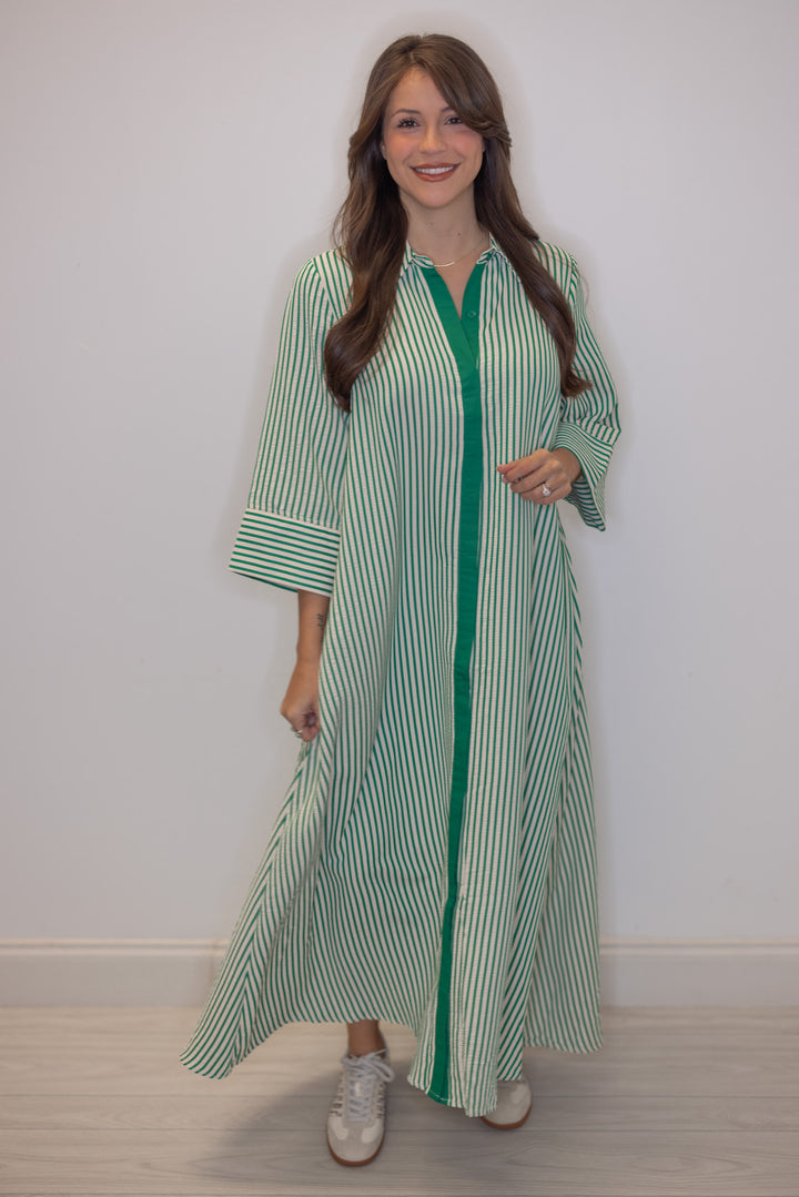 Women's striped green maxi dress by Entro showing flattering striped pattern