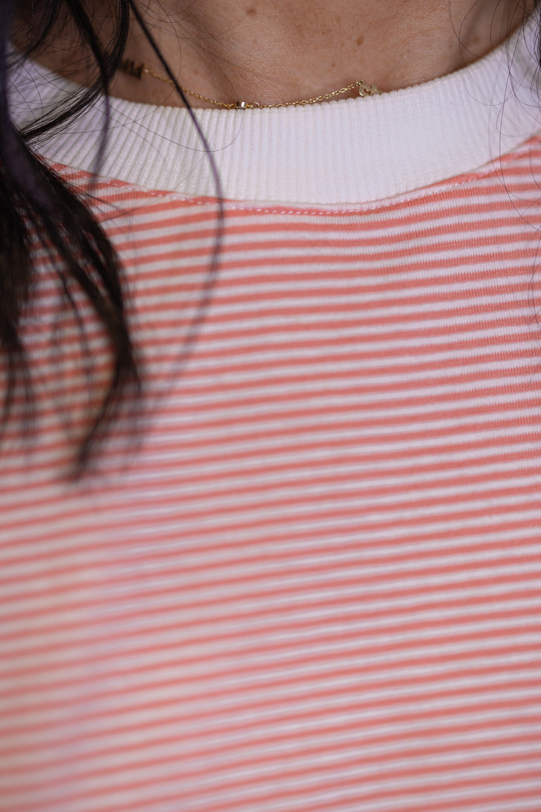 Women's coral and white striped knit oversized top by Wishlist showing close look at striped pattern