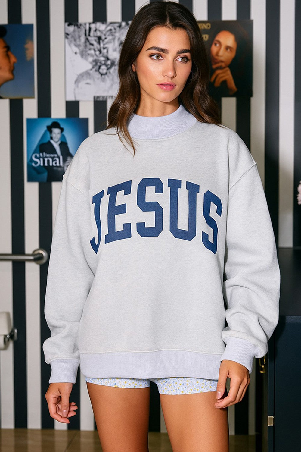 Women's gray mock neck reversible sweatshirt with 'JESUS' printed in blue 