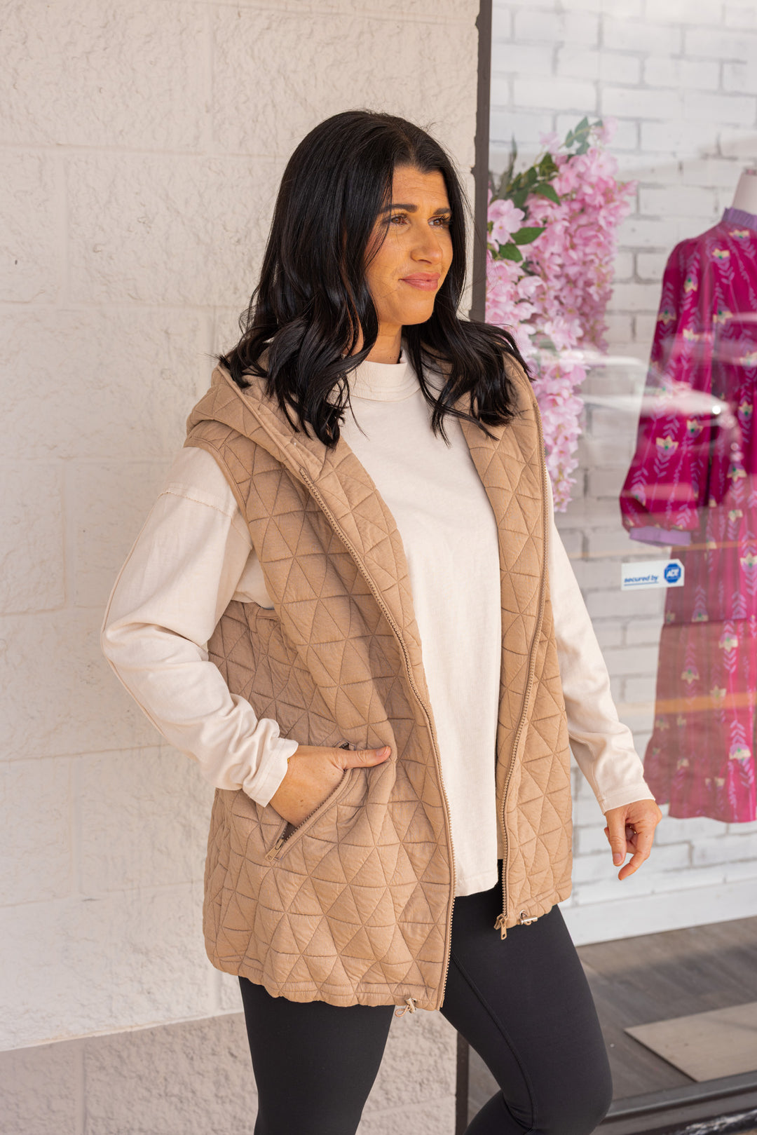 Women's taupe quilted knit puffer vest with hood and cinch hem by She + Sky showing up close side view