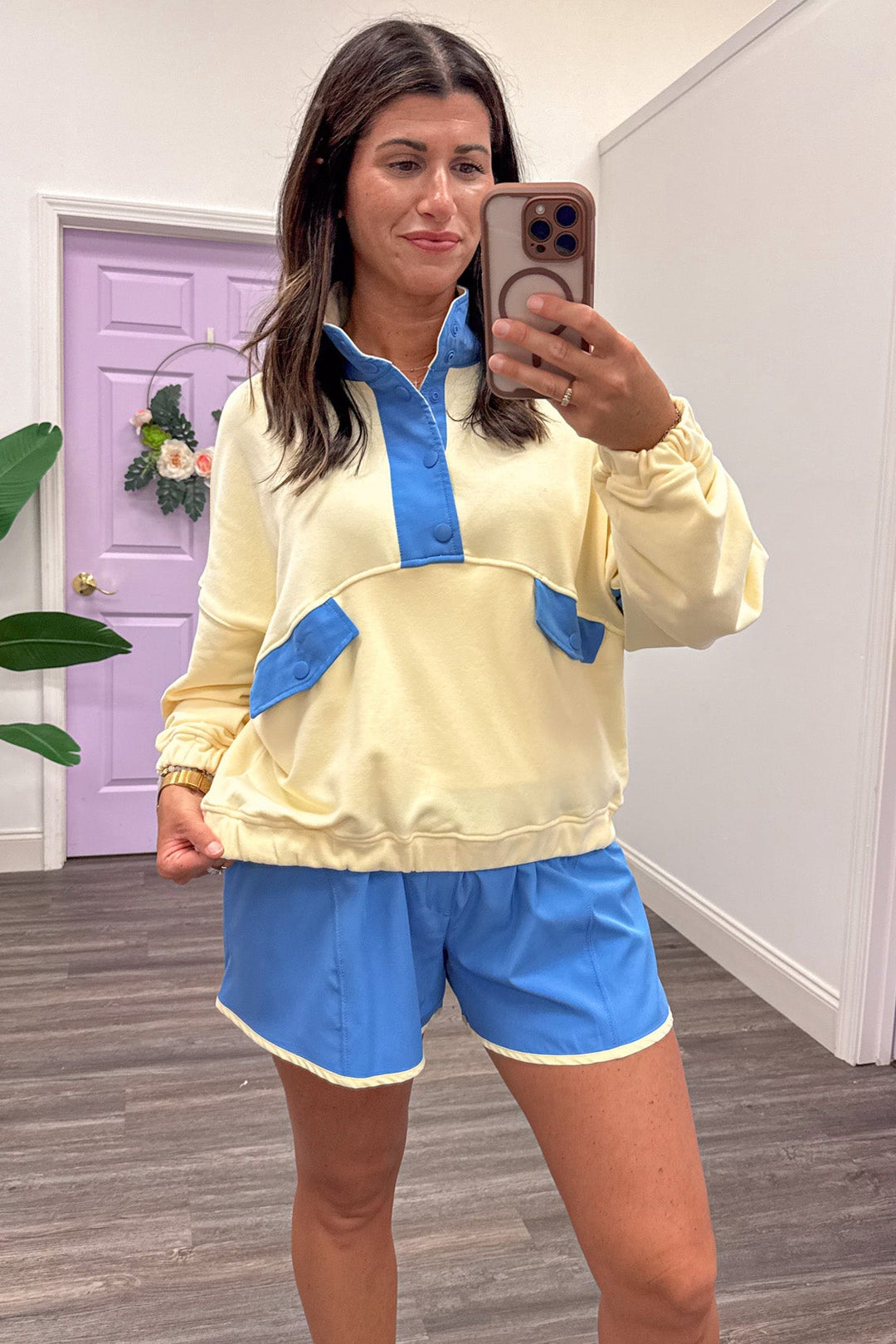 butter yellow with blue colorblock details snap bodice long sleeve pullover with banded bottom hem