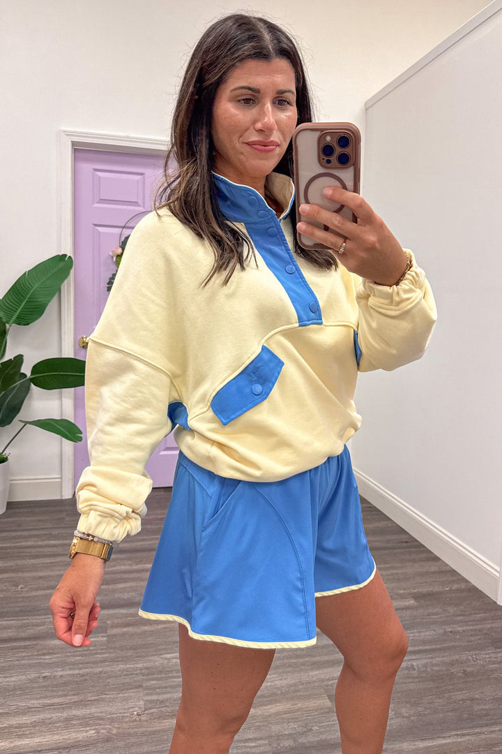 butter yellow with blue colorblock details snap bodice drop shoulder long balloon sleeve pullover