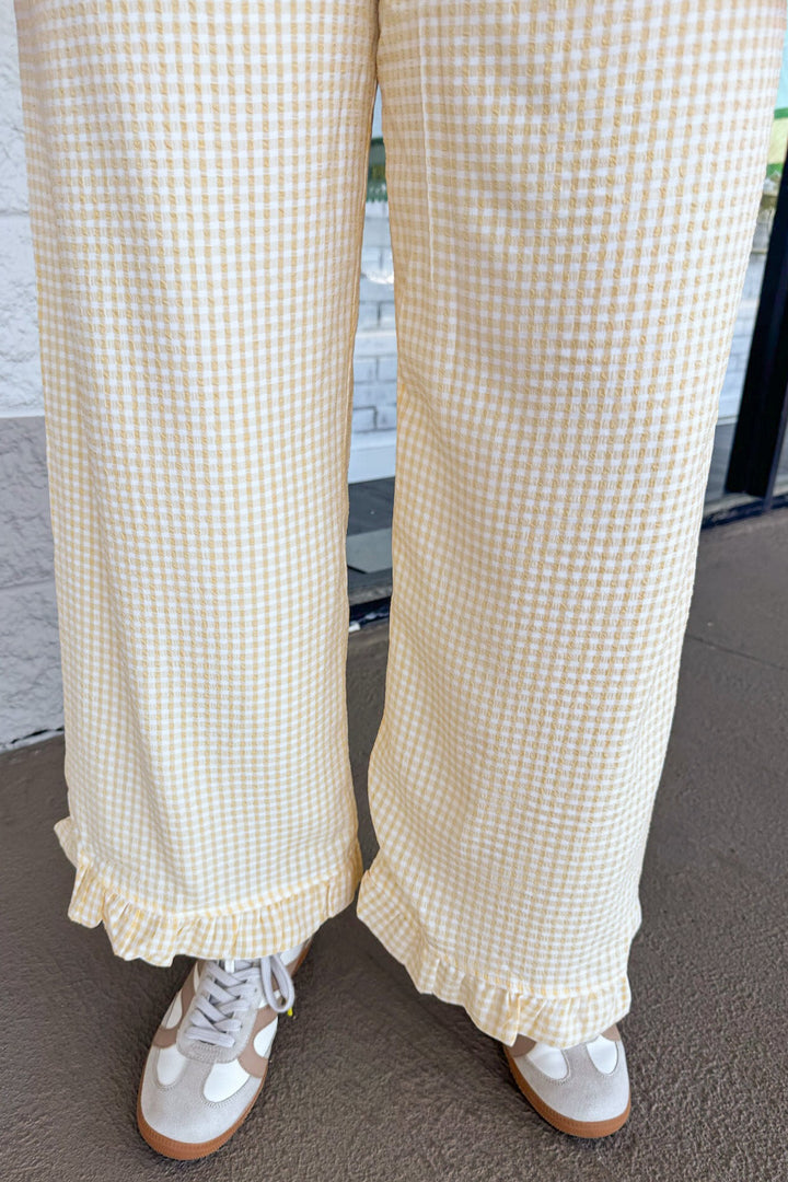 yellow and cream gingham checkered print ruffle hem wide leg textured pants