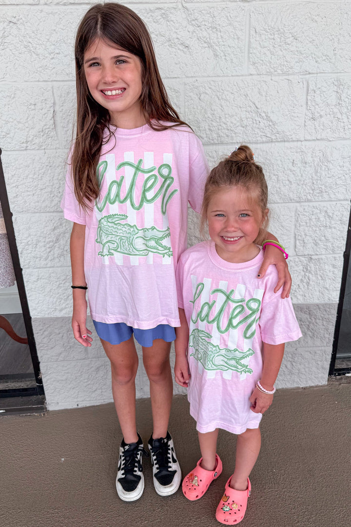youth light pink with white stripes and green later gator graphic print cotton tee